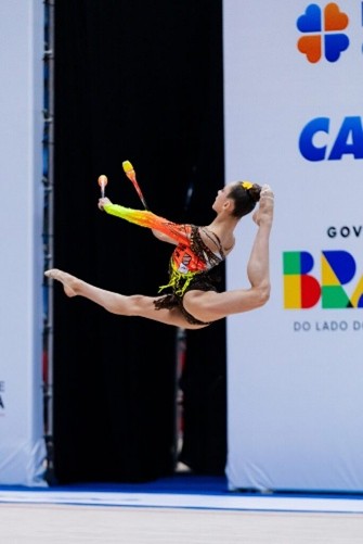 Linda jumping while performing